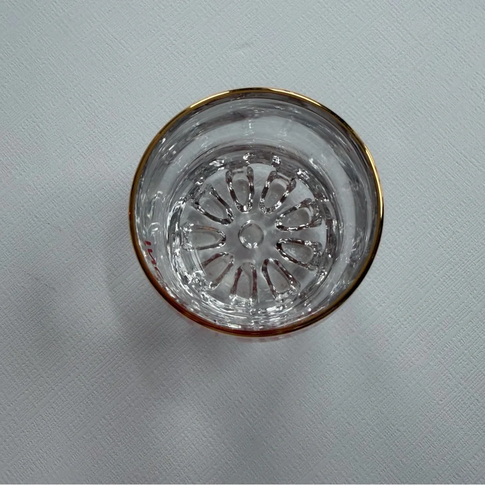 VTG I John Shop in‎ Incirlik, Türkiye shot glass in a gold rim & bold red text